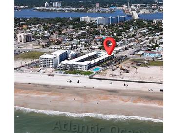 Stunning aerial view showcasing a beachfront condo, pool, and the beautiful Atlantic Ocean at 935 S Atlantic Ave # 244, Daytona Beach, FL 32118