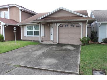 Charming one-story home with a well-maintained front yard, concrete driveway, and single-car garage at 1827 Blaine Ter, Winter Park, FL 32792