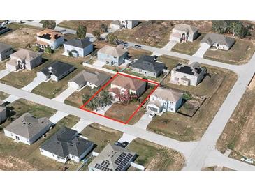 Aerial view showcasing the property's location within a residential neighborhood; neatly lined with paved roads at 2305 Rio Grande Forest Ln, Kissimmee, FL 34759