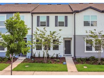 Charming townhouse with well-maintained lawn and manicured landscaping in a desirable community at 3335 Azolla St, Orlando, FL 32808