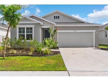 Charming single-story home features a well-maintained lawn, landscaping, and a two-car garage at 1120 Mattie Pointe Blvd, Auburndale, FL 33823