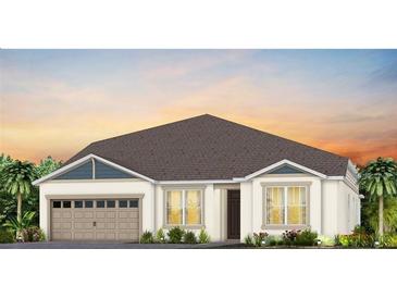 Charming one-story home featuring a two-car garage, well-manicured lawn and a neutral color palette at 16352 Crown Top Dr, Montverde, FL 34756