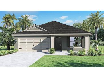 Charming one-story home with a well-manicured lawn, featuring a two-car garage and inviting front entrance at 223 Taylor Groves St, Lake Wales, FL 33898