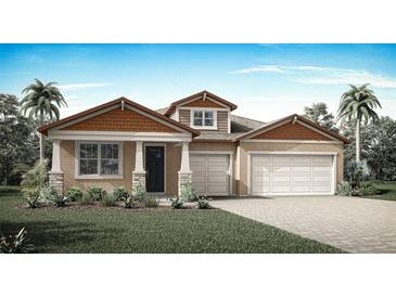 Charming single Gathering home featuring a two-car garage, manicured lawn and a welcoming front porch at 2639 Ginseng Ivy St, Apopka, FL 32703