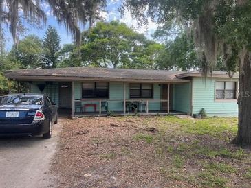 Charming one-story home with ample front yard and mature trees at 6251 Bolling Dr, Orlando, FL 32808