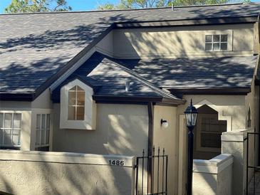 Charming townhouse featuring a classic design and architectural details at 1486 Farrindon Cir, Lake Mary, FL 32746