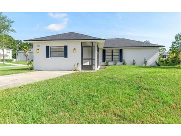 Charming single-story home featuring a well-maintained lawn and a welcoming front porch at 1750 Mitten Ter, Deltona, FL 32738