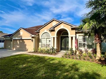 Charming single Gathering home with a manicured lawn, two car garage and gorgeous architectural details at 2643 Aloma Oaks Dr, Oviedo, FL 32765