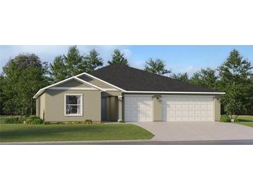 Charming one-story home featuring a two-car garage and a well-maintained lawn at 2030 Forage Dr, Kissimmee, FL 34746