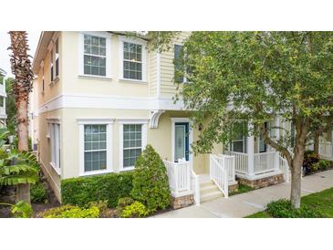 Charming two-story home with a lovely porch and well-maintained landscaping at 338 Roberts Family Ln, Winter Springs, FL 32708