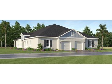 Charming single-story home featuring a symmetrical facade, two-car garage, and beautifully landscaped front yard at 4343 Curacao Pl, Kissimmee, FL 34758