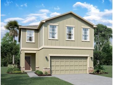 Charming two-story home with neutral siding, attached two-car garage, and well-maintained landscaping at 1397 Dalkeith Cv, Sanford, FL 32771