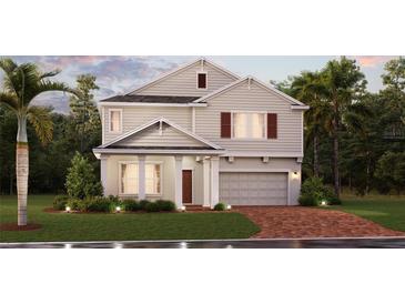 Charming two-story home with a welcoming front porch, attached garage, and beautifully landscaped front yard at 1851 Blissful Dr, Kissimmee, FL 34744
