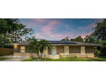 Charming single-story home featuring a cozy front yard and solar panels at 3431 Hunt Ln, Oviedo, FL 32765