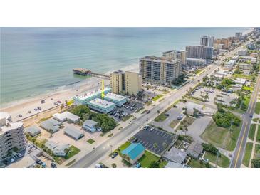 Aerial view of a beachfront condo complex with easy access to the beach, pier, and main street at 3641 S Atlantic Ave # 110, Daytona Beach, FL 32118
