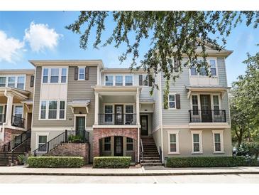 Charming townhome with inviting porch and well-maintained landscaping for great curb appeal at 439 Windmill Palm Cir, Altamonte Springs, FL 32701