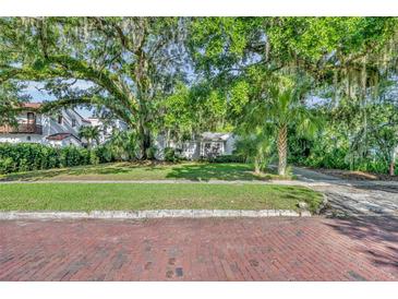 Charming home with mature trees and well-manicured lawn at 171 Cortland Ave, Winter Park, FL 32789