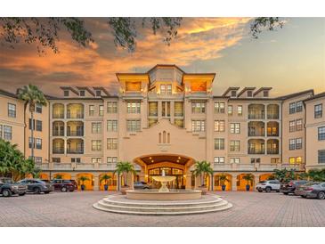 Stunning building exterior with a fountain and meticulously maintained landscaping creates an inviting curb appeal at 500 Mirasol Cir # 203, Celebration, FL 34747