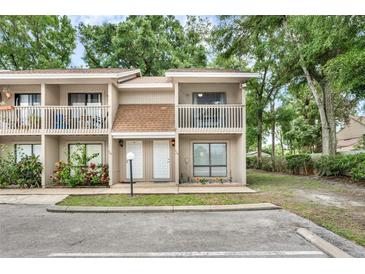 Inviting townhome with a charming exterior, featuring a cozy balcony and well-maintained landscaping at 752 Howland Ln # 114, Altamonte Springs, FL 32701
