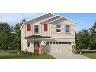 Charming two-story home with beige siding, red shutters, a two-car garage and a well maintained lawn at 3852 Corsican Pl, Lake Alfred, FL 33850