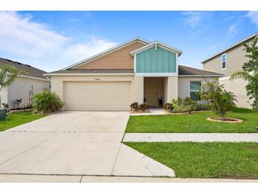 Charming single-story home features a well-maintained lawn and a two-car garage at 4444 Quartz Ct, Lakeland, FL 33811