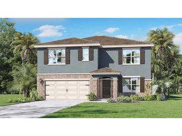 Charming two-story home with a stone facade, neutral paint, shutters, and a well-manicured lawn at 4965 Katrina Dr, Haines City, FL 33844
