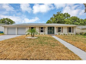 Charming single-story home with a well-manicured front yard and double-door entryway for a classic look at 822 Glen Arden Way, Altamonte Springs, FL 32701