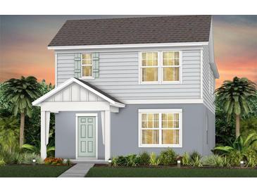 Charming two-story home with a welcoming front porch and lush landscaping at 2237 Southbury Dr, Kissimmee, FL 34744