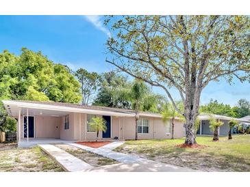Charming single-story home featuring a neatly landscaped front yard and cozy covered entryway at 1533 Fort Smith Blvd, Deltona, FL 32725