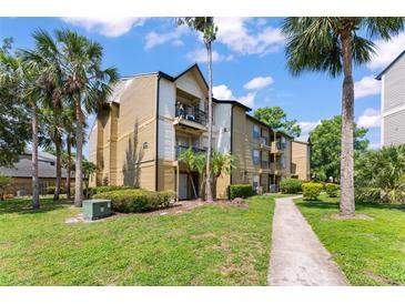 Well-maintained condo complex with manicured landscaping and vibrant green spaces at 1908 Lake Atriums Cir # 3, Orlando, FL 32839