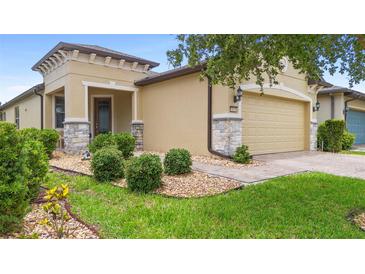 Charming single-Gathering home featuring manicured landscaping and a welcoming two-car garage at 1028 Salamanca Pl, Davenport, FL 33837