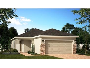 Charming single-story home with a two-car garage, stone accents, and well-manicured landscaping at 1369 Sawgrass Hammock Ln, Davenport, FL 33837