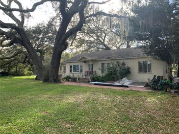 Charming single-story home with a spacious yard and mature trees providing ample shade at 2223 Kilmer Ln, Apopka, FL 32703