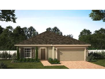 Inviting one-story home with a neutral color scheme, attached garage, and a well-maintained lawn at 6056 Vision Rd, St Cloud, FL 34771