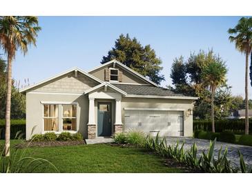 Charming one-story home featuring manicured lawn, neutral colors, and attached two-car garage at 13518 Maria Lavin Circle Rd, Orlando, FL 32828