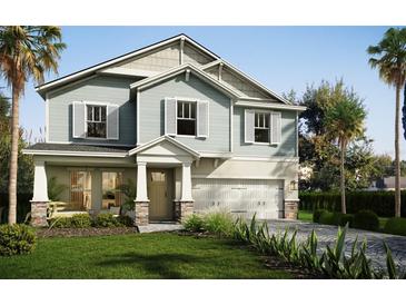 Charming two-story home with large windows, shutters, and a manicured front lawn at 13518 Maria Lavin Circle Rd, Orlando, FL 32828