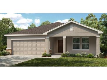Charming single-story home with a neutral color scheme, two-car garage and landscaped yard at 136 Jones Fish Camp Rd, Edgewater, FL 32141