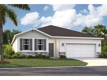Charming single-story home featuring stone accents, gray shutters, manicured lawn, and attached two-car garage at 1802 Lattice Way, St Cloud, FL 34771