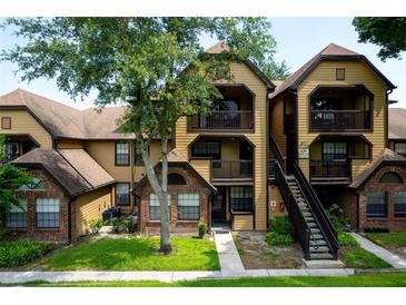 Charming condo complex with well-manicured landscaping, private balcony, and convenient stairway access to multiple units at 420 Forestway Cir # 306, Altamonte Springs, FL 32701