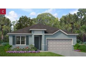 Charming single-story home features a two-car garage, manicured lawn, and beautiful landscaping at 3088 Windswept, Wildwood, FL 34785