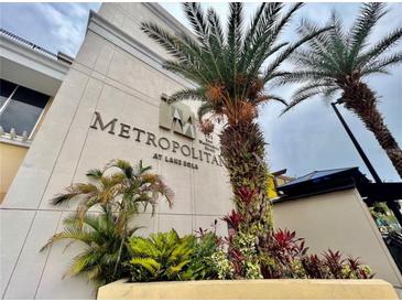 The Metropolitan at Lake Eola with lush tropical landscaping at the building's entrance at 151 E Washington St # 5B, Orlando, FL 32801