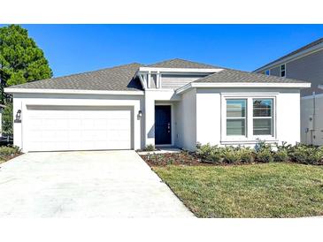 Charming single Gathering home with a two-car garage, manicured lawn, and easy-to-maintain landscaping at 3977 Willowbrook Dr, Edgewater, FL 32141