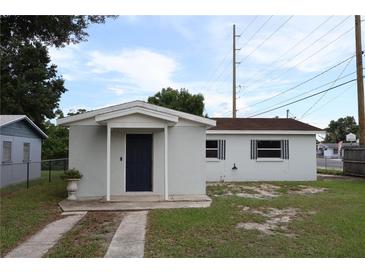 Charming single-story home featuring a driveway and inviting covered entrance at 102 Luna Rd, Auburndale, FL 33823