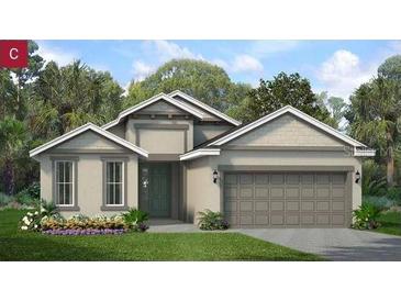 Charming single-story home featuring a two-car garage, neutral paint, and a well-manicured lawn with beautiful landscaping at 2357 Sirena Ln, Mount Dora, FL 32757