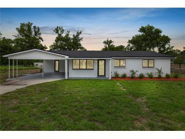 Charming single-story home with a well-manicured lawn and a convenient covered carport at 2549 Gress Ln, Lakeland, FL 33805
