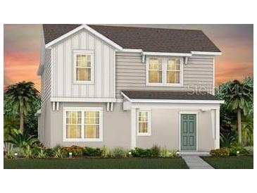 Charming two-story home featuring a modern design with a combination of siding and a well-manicured lawn at 5021 Starling Bird Ln, St Cloud, FL 34771