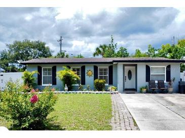 Charming single-story home featuring a well-manicured lawn, classic shutters, and a welcoming front entrance at 517 Ivanhoe Way, Casselberry, FL 32707