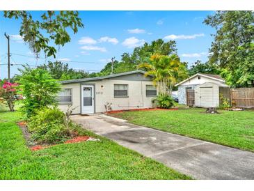 Charming single-story home with well-maintained lawn and a concrete driveway leading to the front door at 1170 E Bay St, Winter Garden, FL 34787