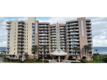 Multi-story beachfront condo building boasts ocean views from private balconies and lush landscaping in a serene setting at 1925 S Atlantic Ave # 411, Daytona Beach, FL 32118