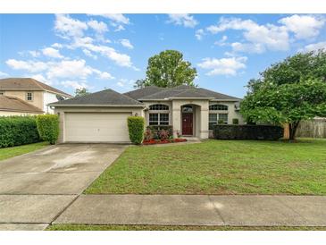 Charming single-story home with well-maintained lawn and inviting curb appeal at 2063 Killinger St, Deltona, FL 32738